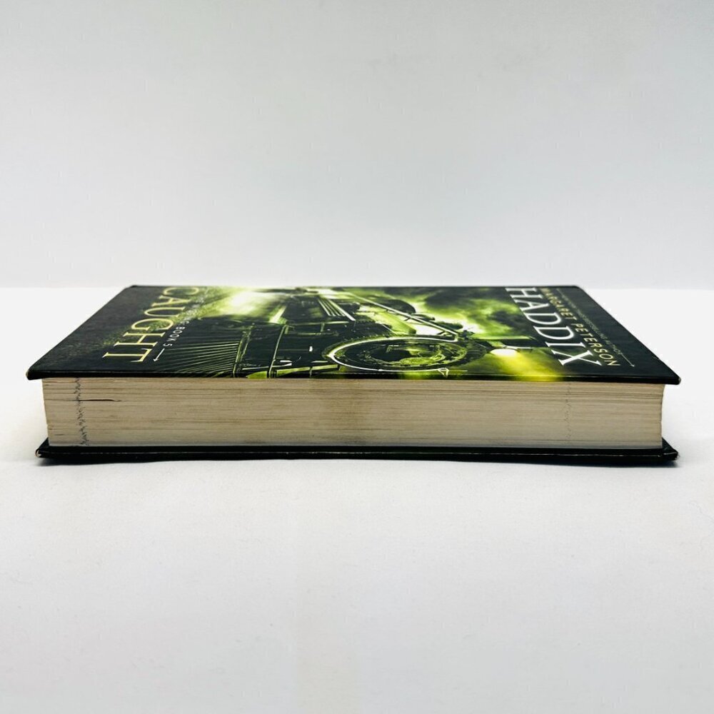 The Missing: Book 5 Caught Hardcover Book by Haddix, Margaret Peterson - Picture 4 of 7